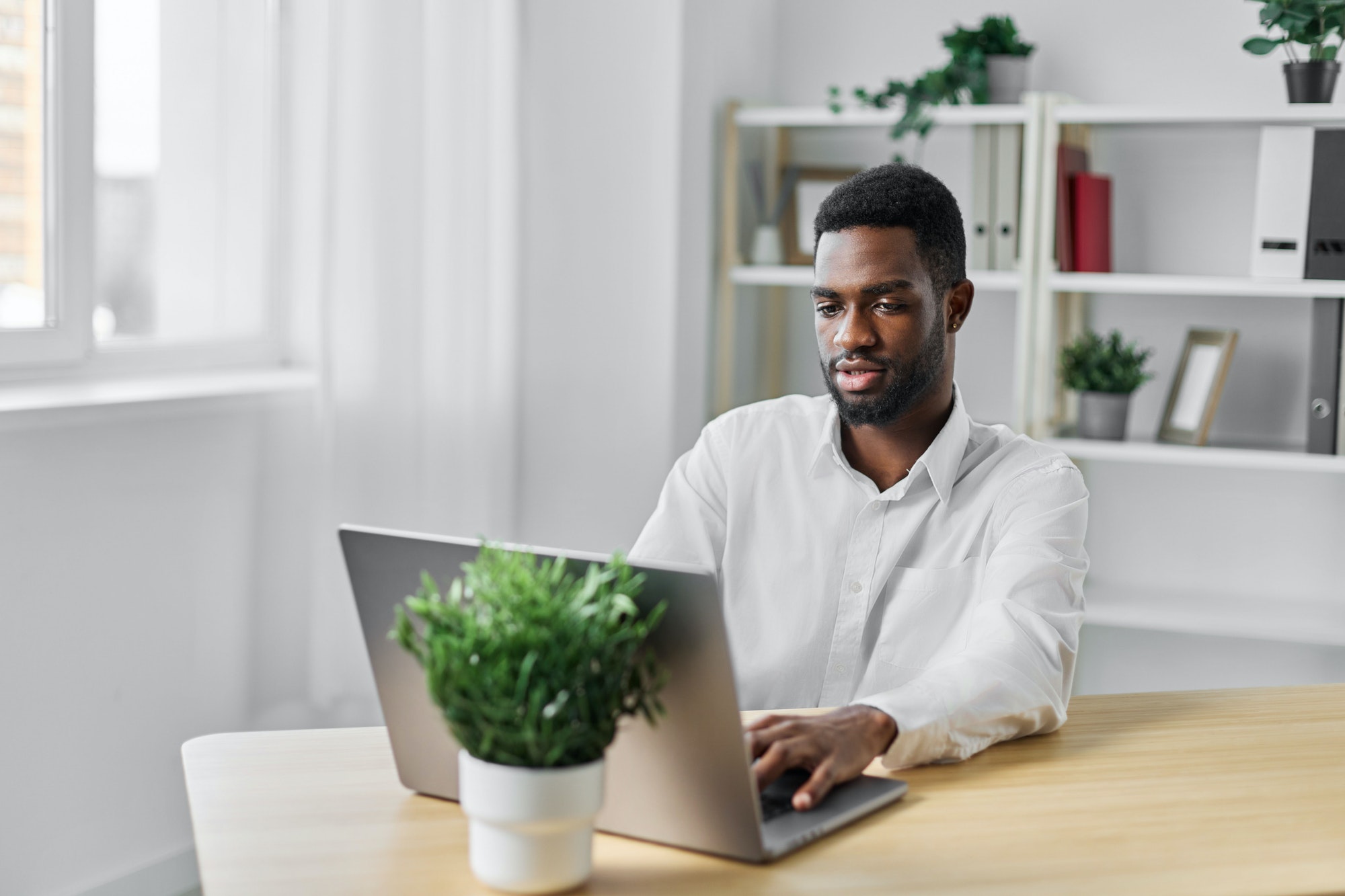 man student education job online freelancer laptop computer office african american person